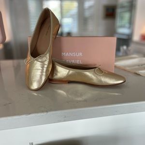 Gold ballet flats. New in box